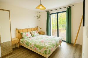 En eller flere senge i et værelse på Le Nid de l'Etier, 4 chambres