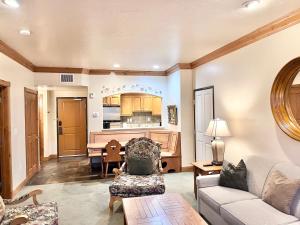 a living room with a couch and a piano at Family-Friendly Zermatt 2BR 2BA Villa Near Park City & Deer Valley Ski Resorts - 4749 in Mound City
