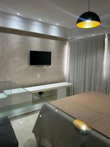 TV a/nebo společenská místnost v ubytování Apart estiloso e confortável!! + 3 fotografie