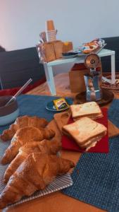 a table topped with bread and pastries on a table at Jamari Sangro House in Castel di Sangro