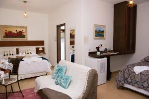 Ένα ή περισσότερα κρεβάτια σε δωμάτιο στο Pousada Medeiros