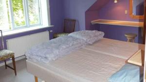 Ένα ή περισσότερα κρεβάτια σε δωμάτιο στο Cozy Holiday Apartment In Scenic Surroundings