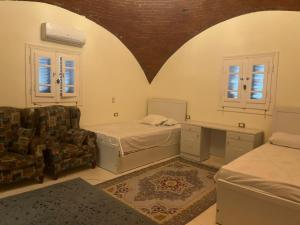 Ένα ή περισσότερα κρεβάτια σε δωμάτιο στο Mountain Camp Ali Khaled +102 φωτογραφίες