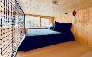 a bed in a room with a window at Architect Drawn Cabin With Sea View At Stokkøy in Hosen