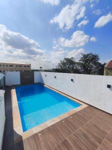 Bazén v ubytování Olegário Bueno 230 nebo v jeho okolí