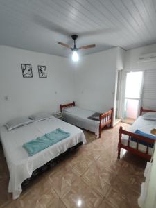 Postel nebo postele na pokoji v ubytování Olegário Bueno 230