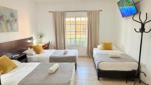 Postel nebo postele na pokoji v ubytování G7 Confortable Monoambiente Triple con Cochera