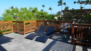 a pair of chairs sitting on a deck at Loft Jeri Premium in Jericoacoara