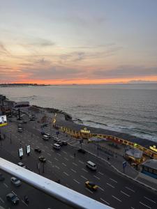 a view of a parking lot next to the ocean at ALEX HOMES - Sporting Cozy Apartments with Direct Sea View in Alexandria