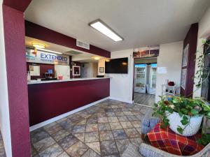 a lobby of a fast food restaurant with two chairs at Willcox Extended Inn and Suites in Willcox