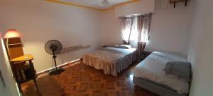 Ένα ή περισσότερα κρεβάτια σε δωμάτιο στο Casa Tristán