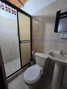 a bathroom with a toilet and a sink at Hotel Monte verde in Salento