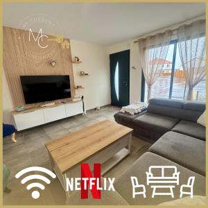 Et tv og/eller underholdning på Le Nid de l'Etier, 4 chambres