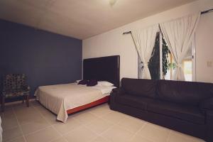 Postel nebo postele na pokoji v ubytování Hotel Vista Verde