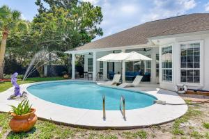 a swimming pool in the backyard of a house at Edwards' Palace in Panama City Beach