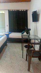 TV a/nebo společenská místnost v ubytování Casa Holistica Cali