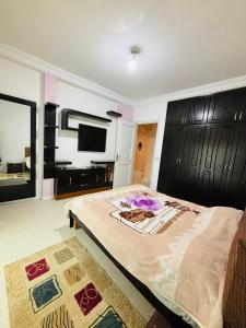 Giường trong phòng chung tại Dream Appartement Monastir +3 ảnh