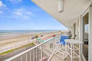 a balcony with a view of the beach at WHAT A VIEW!!!! Full Oceanview, Kitchen, King Bed in Daytona Beach