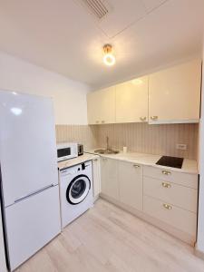 Køkken eller tekøkken på Aparthotel Rin Grand