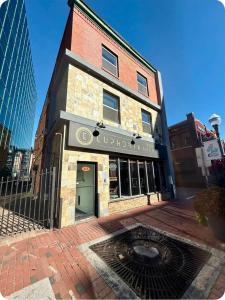 a building with a sign on the front of it at Kiari Suites on Main in Moncton
