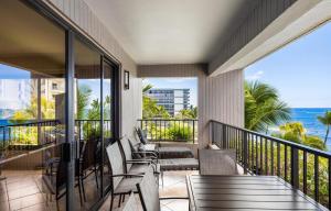 a balcony with chairs and a view of the ocean at Kaanapali Alii 2 Bedroom Oceanfront in Kaanapali