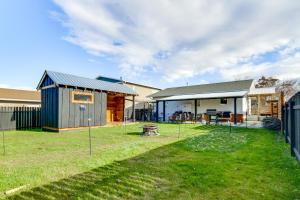 a home with a yard with a house at 12 Mi to Bozeman Pet-Friendly Gem with Sauna and Yard in Belgrade