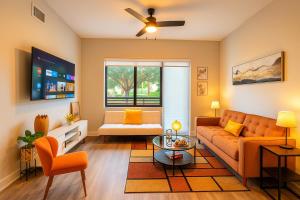 a living room with a couch and a table at Luxe & cozy 3Beds,2rooms,EV Gym Near Beaches&Downtown WPB in West Palm Beach