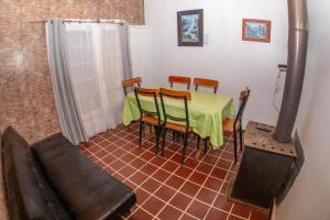 a room with a table and chairs and a couch at Habitaciones y Apartamentos el Caleuche El Tabo in El Tabo