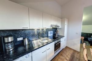 Η κουζίνα ή μικρή κουζίνα στο Ferienwohnung in Burhave