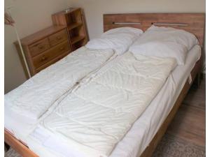 Una cama o camas en una habitación de Ferienwohnung am Deich in Burhave