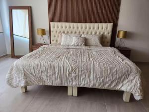 En eller flere senge i et værelse på 15 Súper Loft con Aire Acondicionado, Consulado