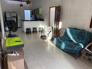 a living room with a couch and a table at Casa por temporada Barra Nova in Marechal Deodoro