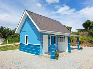 a blue shed with a grey roof at Teratak Sumayyah 1 - For Islam only - Pondok Lenggong in Kampong Banggol Belimbing