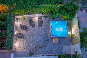 an overhead view of a patio with a swimming pool at Apartments with parking space Vrboska, Hvar - 24967 in Vrboska