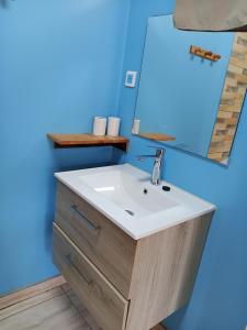 a bathroom with a sink and a mirror at O'Hani-Ura lodge in Bora Bora +24 photos