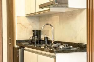 Kuchyň nebo kuchyňský kout v ubytování NUEVO!! loft de LUJO en El Rodadero a pasos de la playa