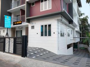 a building with a gate in front of it at ElShium Homes in Cochin