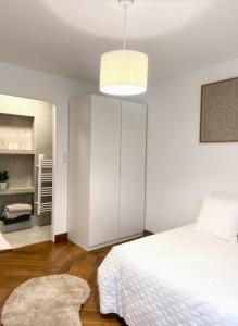 Ένα ή περισσότερα κρεβάτια σε δωμάτιο στο Le Glow - Élégant - Paisible - Parking