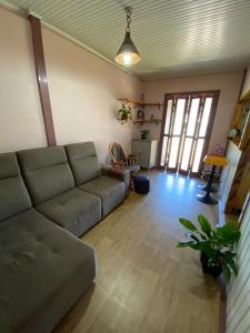 a living room with a couch and a table at Igrejinha RS in Igrejinha