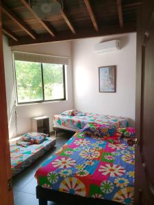 Un pat sau paturi într-o cameră la Casa Lili