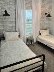 Ένα ή περισσότερα κρεβάτια σε δωμάτιο στο The Stillwater Cottage