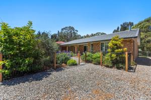 a house with a fence in front of it at Callala Bay & Beach House - Pet Friendly with Fireplace in Callala Bay