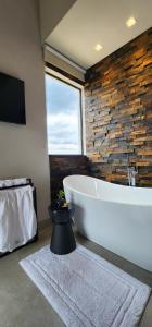 TV a/nebo společenská místnost v ubytování Lavras Inn + 46 fotografií