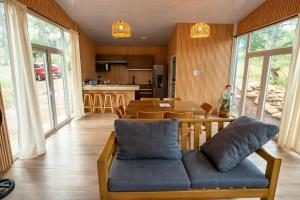 a living room with a couch and a table at Cabaña Arroyo de los Venados in Atemajac de Brizuela +34 photos