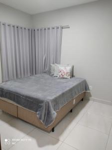 Ένα ή περισσότερα κρεβάτια σε δωμάτιο στο Chalé em Bananeiras