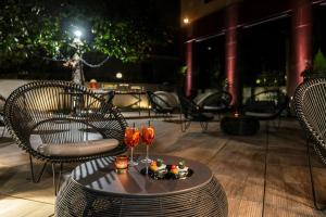 a table with a tray of food and drinks on a patio at Starhotels Ritz in Milan