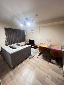 Ένα ή περισσότερα κρεβάτια σε δωμάτιο στο ホロムア澄川