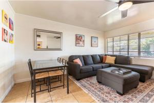 a living room with a couch and a table at *Free Parking near Strip Cozy 2Br home Side: A in Las Vegas +10 photos