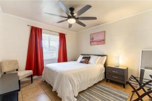 a bedroom with a bed and a ceiling fan at *Free Parking near Strip Cozy 2Br home Side: A in Las Vegas