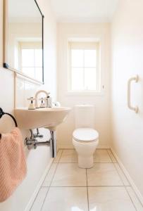 a bathroom with a sink and a toilet at Kingston apartment in Kingston